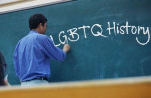 https-shererlaw-com-wp-content-uploads-2020-04-teacher-teaching-lgbt-history-300x194-jpg