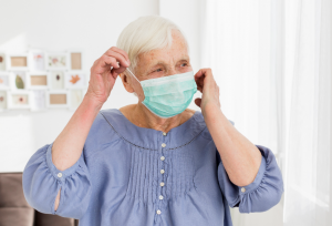 https-www-collinslaw-com-blog-wp-content-uploads-2020-05-elderly-woman-in-mask-300x204-png