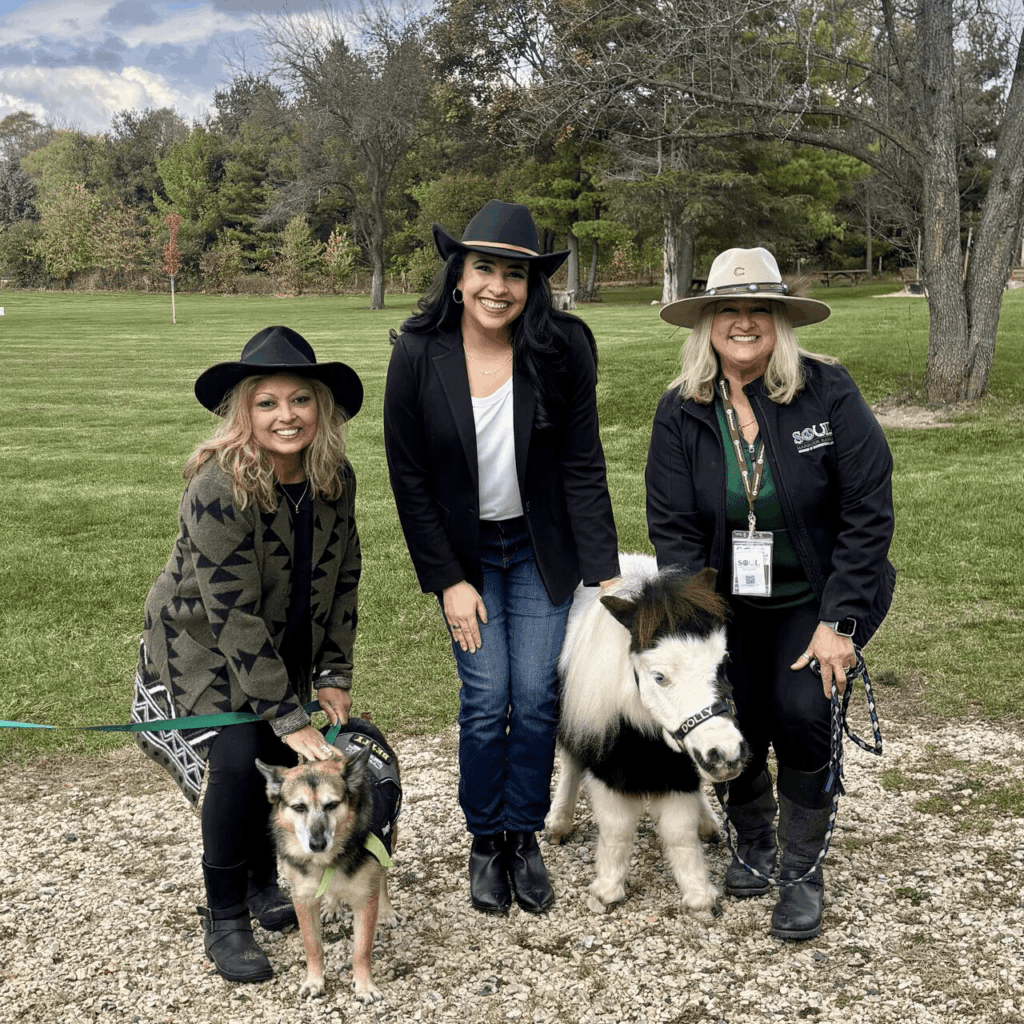 From left to right: Hon. Antara Nath Rivera, me, and Jodie Diegel with therapy animals.